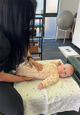 Chiropractor Porirua NZ Henisha Tailor Adjusting Baby